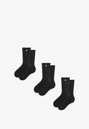 Mustad puuvillased sokid, ribitud tekstuur, krepppikkus, millel on väike logo. Neli paari on korraldatud kahte komplekti. Pehme, ühtlane värv.