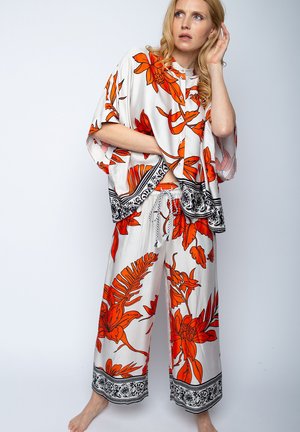 Trousers - orange black flower
