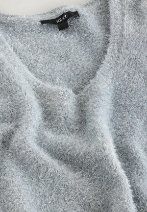 Light blue, fluffy sweater with a v-neck design, featuring a soft texture and shiny, silver threads throughout. Brand label visible.