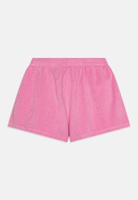 Rosa bomullshorts med elastisk midje, laget av et lett, litt teksturert materiale og en avslappet passform.