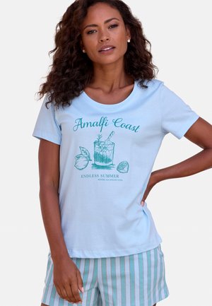 Light blue T-shirt with "Amalfi Coast" graphic, featuring a drink glass and fruit illustrations; paired with striped shorts in pastel colors.