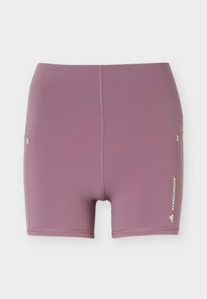 Lilla højttaljede atletiske cykelshorts med centralsøm og lille hvid "HKOUMORI"-logo på venstre lår.