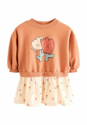 Peach long-sleeve top with smiling red and white flowers graphic and cream skirt with small orange flower prints, toddler dress style.