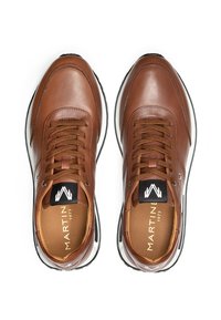 Pair of brown leather sneakers with brown laces, white midsoles, black outsoles, and branded insoles labeled "MARTIN 1973."