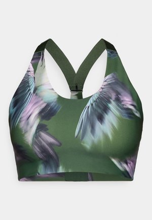 Sportowy biustonosz w ciemnej zieleni z wyrazistym kwiatowym wzorem w odcieniach purpury i niebieskiego. Posiada plecy w stylu racerback oraz elastyczne ramiączka zapewniające wsparcie.