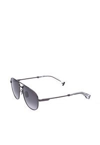 Lunettes de soleil fines à monture métallique noire avec verres dégradés foncés et extrémités de branches en plastique transparent, présentées en angle trois quarts sur fond blanc.