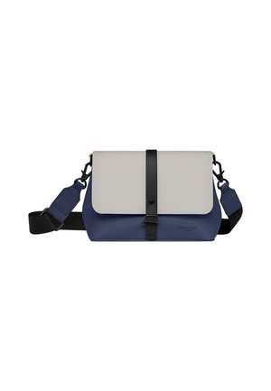 Messenger bag with a grey flap and navy body. Made of durable material, features adjustable strap and black hardware accents.