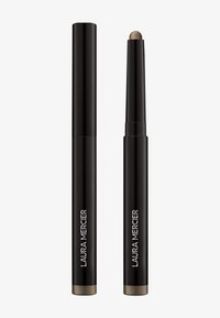 Laura Mercier øyenskygge-stift i en matt svart boks, med en metallisk bronse-spiss. Slank sylinderformet design, glatt tekstur.