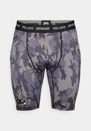 Grå kamouflagekompressionsshorts med svart midjeband som har texten "Venum Polaris". Mjuk yta med förstärkta sömmar och logotypdetalj.