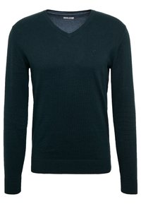 Maglione verde scuro a V realizzato in tessuto morbido, con maniche lunghe e un design aderente, caratterizzato da un logo discreto sul petto.