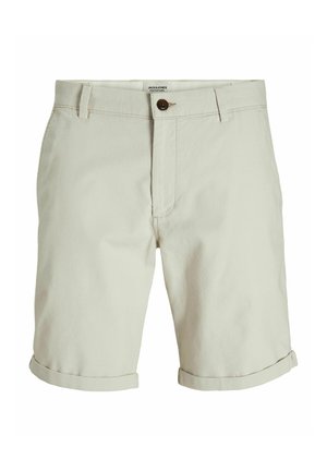 Pantalones cortos de algodón beige con un acabado texturizado, que cuentan con un cierre de botón, dobladillos enrollados y bolsillos laterales.