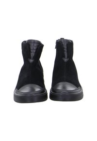 Pair of black suede ankle boots with padded leather tongue and rounded rubber toe caps, viewed from the front on a white background.