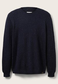 Mörk marinblå stickad ulltröja med prickigt mönster, rund halsringning och ribbade mudd och nederkant, uppvisad liggande.