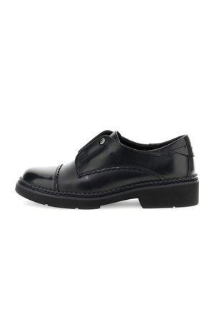 Scarpe nere in pelle slip-on con punta arrotondata, cuciture decorative e suola in gomma. Presentano un sottile accento laterale e una texture liscia.