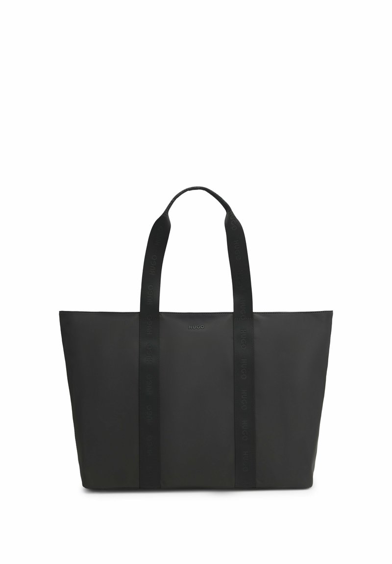 Black rectangular tote bag with two long handles featuring subtle embossed "HUGO" text and small "HUGO" logo on the front center.