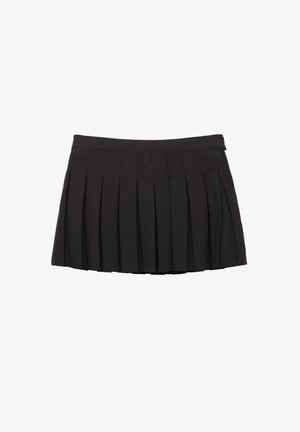 Mini-jupe plissée noire avec une ceinture et une fermeture éclair latérale, présentée sur un fond blanc.