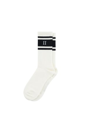 White athletic socks with a ribbed texture, featuring black stripes and a centered "II" in black. Designed for comfort and style.