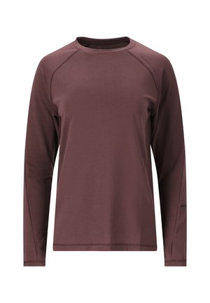 Langærmet skjorte i mørk burgundy, lavet af blødt stof. Har raglanærmer og diskret logodetalje på skulderen. Glat tekstur.