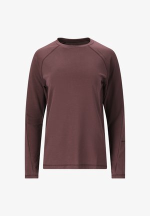 Langærmet skjorte i mørk burgundy, lavet af blødt stof. Har raglanærmer og diskret logodetalje på skulderen. Glat tekstur.