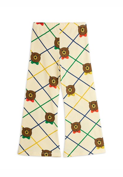 Pantalones de pierna ancha de algodón en crema, con un patrón geométrico de osos marrones y lazos multicolores, acentuados por líneas azules, verdes y amarillas.
