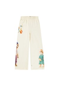 Pantalon crème avec une taille élastique, orné de motifs d'animaux cartoon et d'accents floraux sur le côté, en tissu doux.