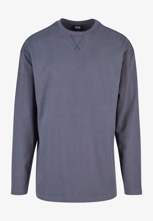 Tumehallist puuvillast pikkade varrukatega särk, millel on ümar kaelus ja ristpistes detailid kaeluse ääres, ning mis on laia lõikega.