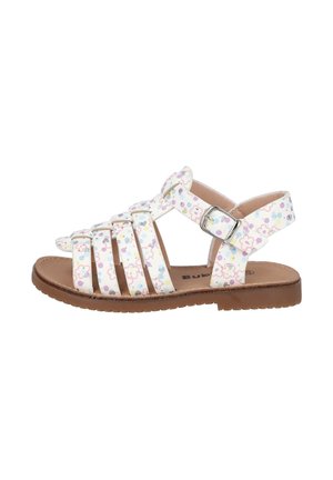 Sandalias blancas con múltiples correas adornadas con un colorido patrón floral. Suela marrón texturizada con cierre de hebilla ajustable.
