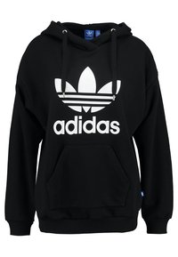 Svart huvtröja med en stor vit Adidas-logotyp och tre stripe-design, som har en framficka och justerbar dragsko för huven.