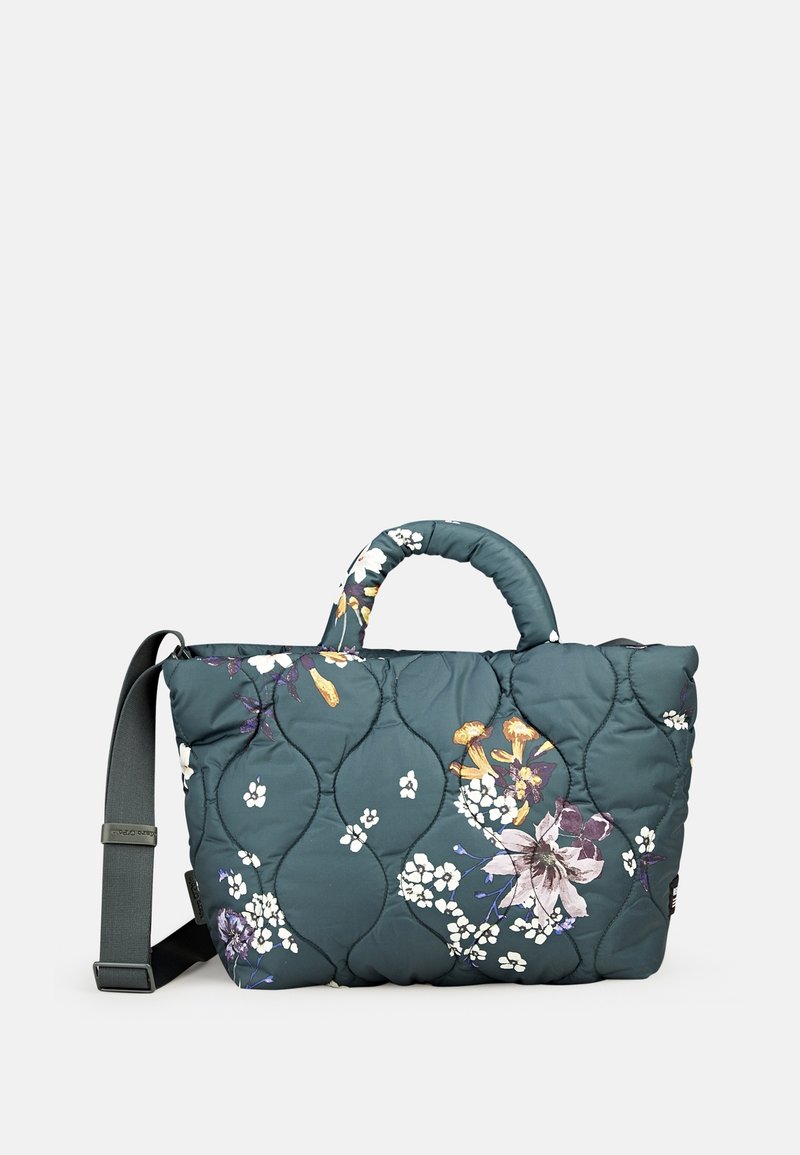 Sac matelassé bleu sarcelle foncé avec des motifs floraux, deux poignées et une bandoulière détachable. Design texturé avec une finition rembourrée.