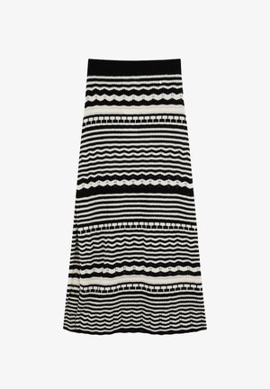 Jupe en tricot noir et blanc avec un motif ondulé horizontal, rayé et géométrique, et une fente latérale à gauche.