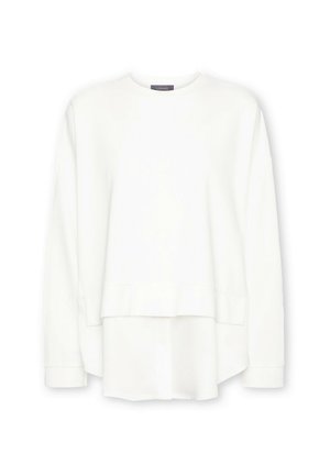 Witte gelaagde sweatshirts met een ronde halslijn en lange mouwen. Heeft een gladde textuur en subtiel laag uitgesneden ontwerp met manchetten.