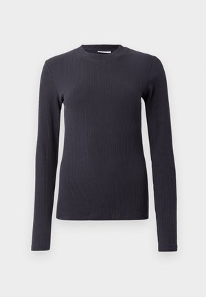 Långärmad ribbad tröja i mörkgrå. Har en rund halsringning och en figurnära silhuett. Tillverkad av ett texturerat tyg. Minimalistisk design.