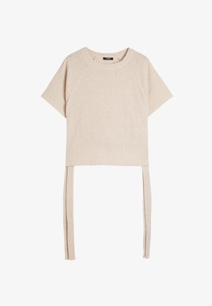 Beżowy sweter typu cropped z krótkimi rękawami raglanowymi, żebrowaną fakturą i dwoma długimi trokami na dole do regulacji lub stylizacji.