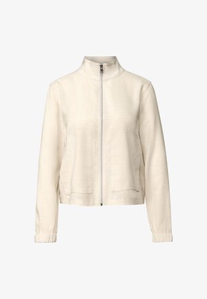 Chaqueta de cremallera beige claro en un tejido texturizado, con un cuello alto, dos bolsillos frontales y puños elásticos para un ajuste ceñido.