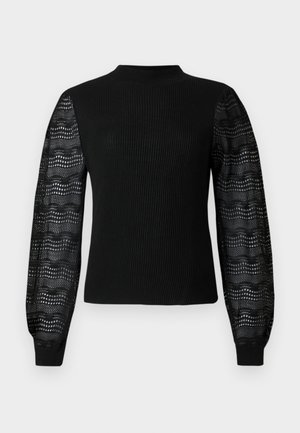 Pulover negru cu o textură ribbed și un guler înalt, având mâneci din dantelă transparentă cu model și manșete strâmte.