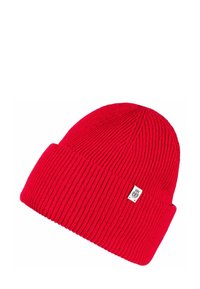 Red knitted beanie featuring a ribbed texture, fold-over cuff, and a small branded tag on the side.