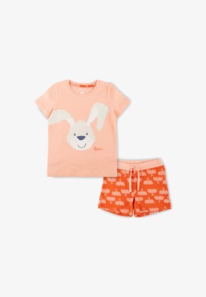 T-shirt rose clair avec un graphique de visage de lapin, assortie à un short orange présentant un motif de petits lapins. Matériau en coton doux.