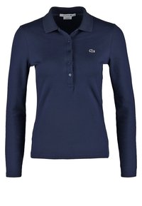 Polo à manches longues marine en coton, doté d'une patte de boutonnage à trois boutons et d'un petit logo brodé sur la poitrine gauche.