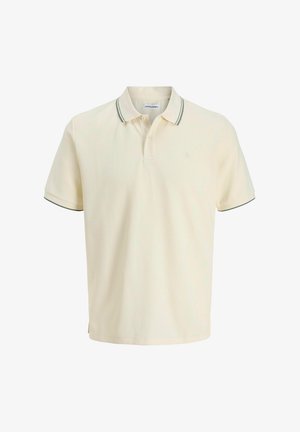 Kreemivärvi polosärk, millel on tekstuuriga kangas, kahe nupuga kaelus, rohelise triibuga krae ja lühikesed varrukad.