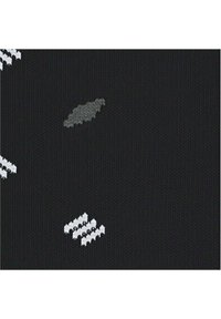 Schwarzer Strickstoff mit weißen und grauen abstrakten Mustern und Texturen. Auffällige Details sind unregelmäßige Formen und ein weicher, gleichmäßiger Webstil.