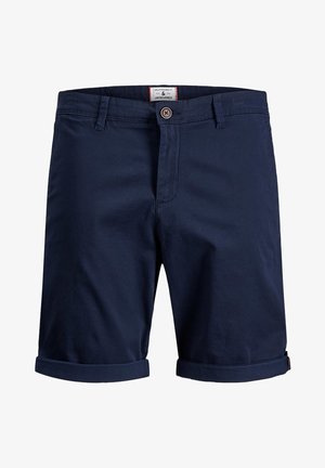 Námořnické modré bavlněné šortky s knoflíkovým zapínáním, ohrnutými manžetami a štítkem viditelným na pase. Hladká textura, ležérní design.