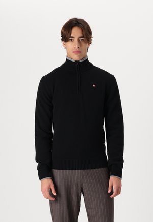 Black sweater with a high collar and half zipper, featuring a ribbed hem and cuffs. Includes a small logo detail on the chest.