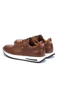 Pair of brown leather casual sneakers with white soles, black tread, and lace-up design on a white background.