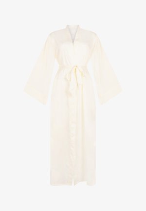 Lang crèmekleurig satijnen huisjapon met brede mouwen en een gestrikt tailleband, voorzien van een V-hals en een split aan de voorkant van de zoom.