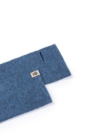 Blue knitted fabric cuff with textured pattern, featuring a small tag with a logo. Cuff has a cutout near the edge for functionality.