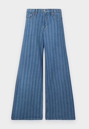 Bredde bukser i middels blå denim med vertikale striper, med knappelukking, fem lommer, og sømdetaljer langs sømmene.