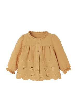 Langärmlige, senfgelbe Bluse mit Rüschensaum, Knopfleiste und besticktem Blumenmuster entlang dem Saum. Texturiert.