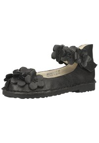 Scarpa piatta nera in pelle con applicazioni floreali sulla punta e cinturino alla caviglia. Finitura texture con suola in gomma flessibile.