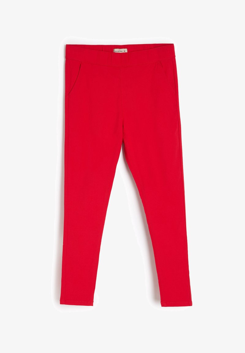 Czerwone legginsy o kroju dopasowanym, z elastycznym pasem, dwoma bocznymi kieszeniami i gładką, matową fakturą. Zaprojektowane z myślą o ścisłym dopasowaniu.