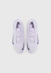 Light purple athletic shoes with a mesh upper, lace closure, and dark purple Nike swoosh. Features a cushioned sole and an accentuated tongue.
